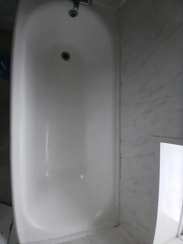 The enamel bath restored to a glossy finish.