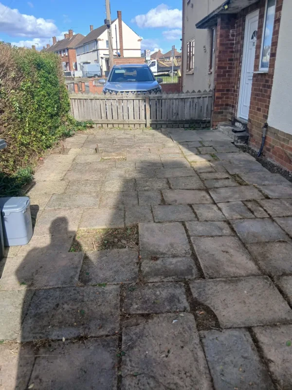 The front garden and paved approach after the reset.