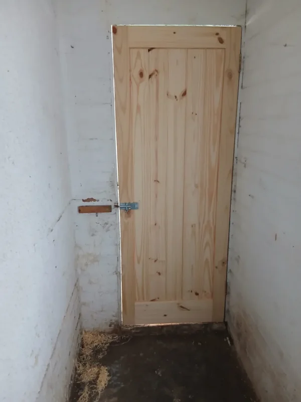 The inside face of the timber door during the work.