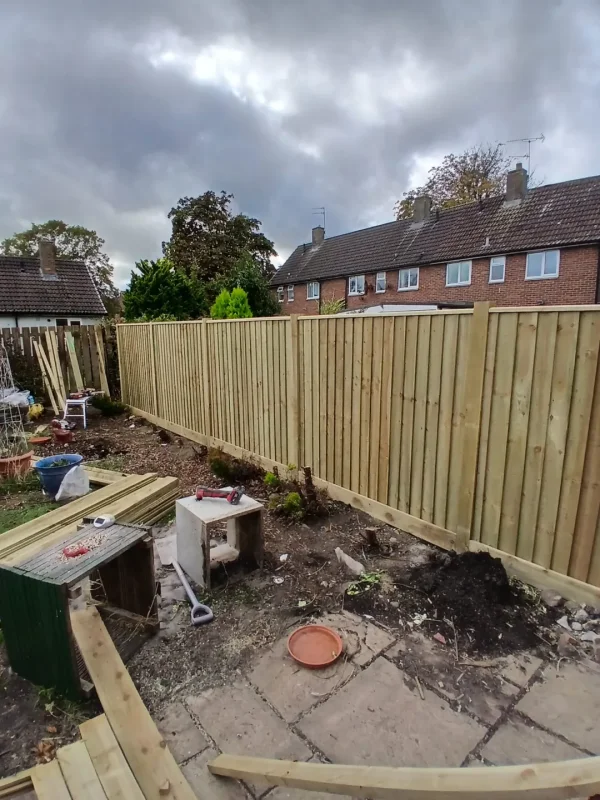 The new fence taking shape along the garden boundary.